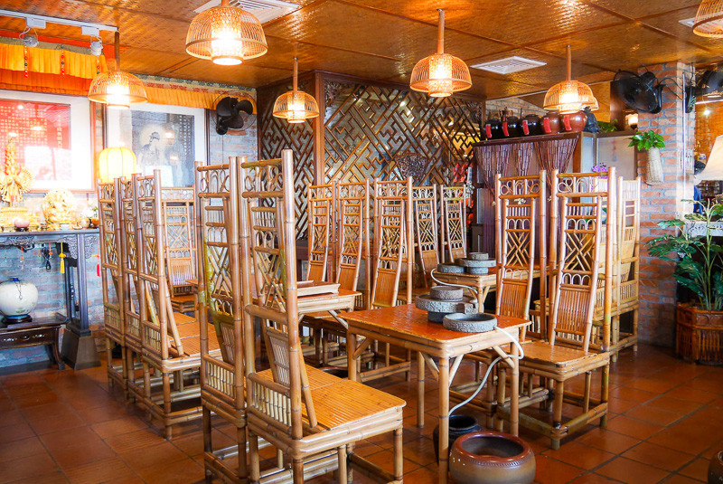 The interior of A-mei Tea House is filled with antique furniture.