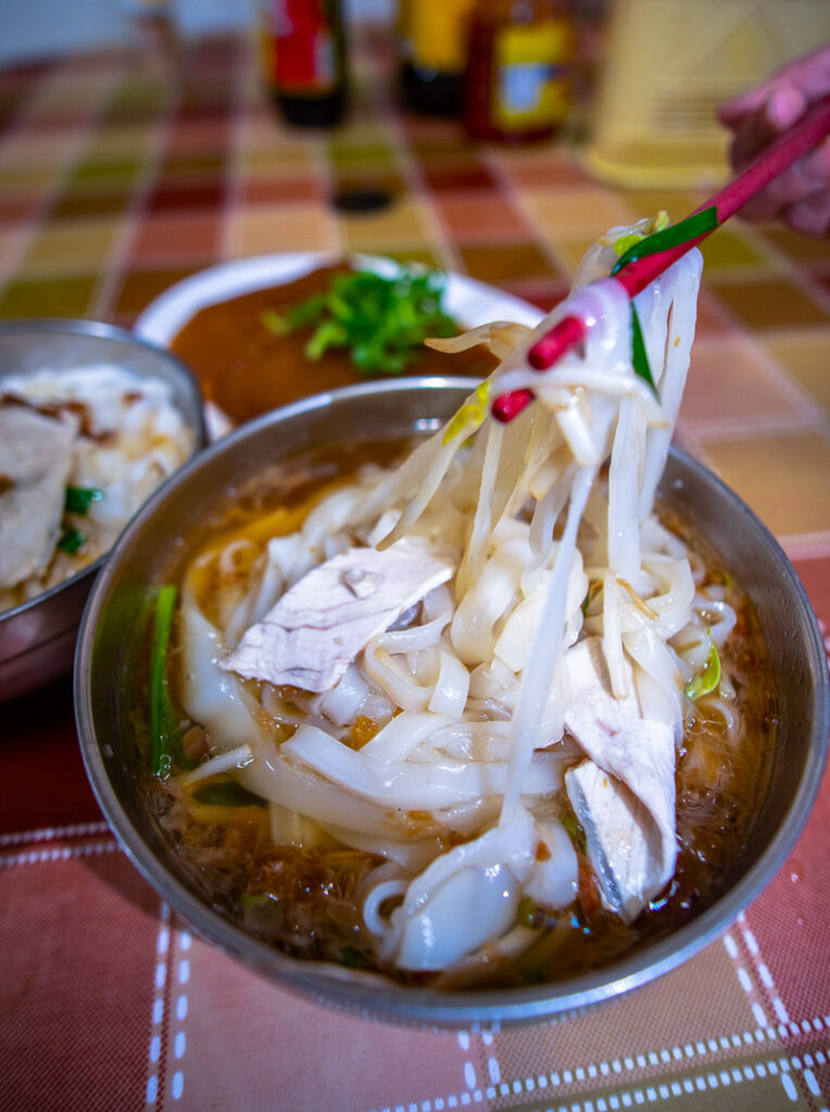 A bowl of Hakka flat rice noodles.