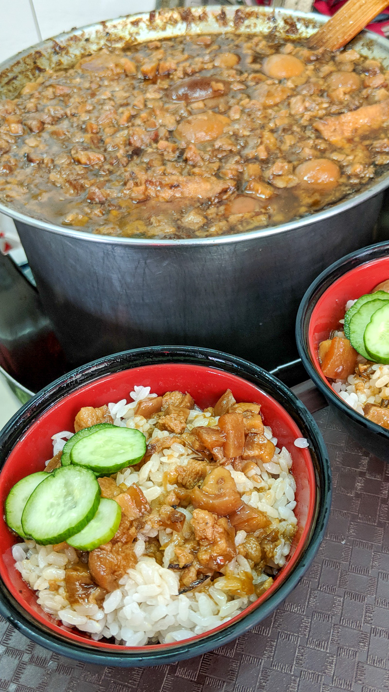 A bowl of braised pork rice with a pickle on the side is typical fare in Tainan's street food oriented districts.