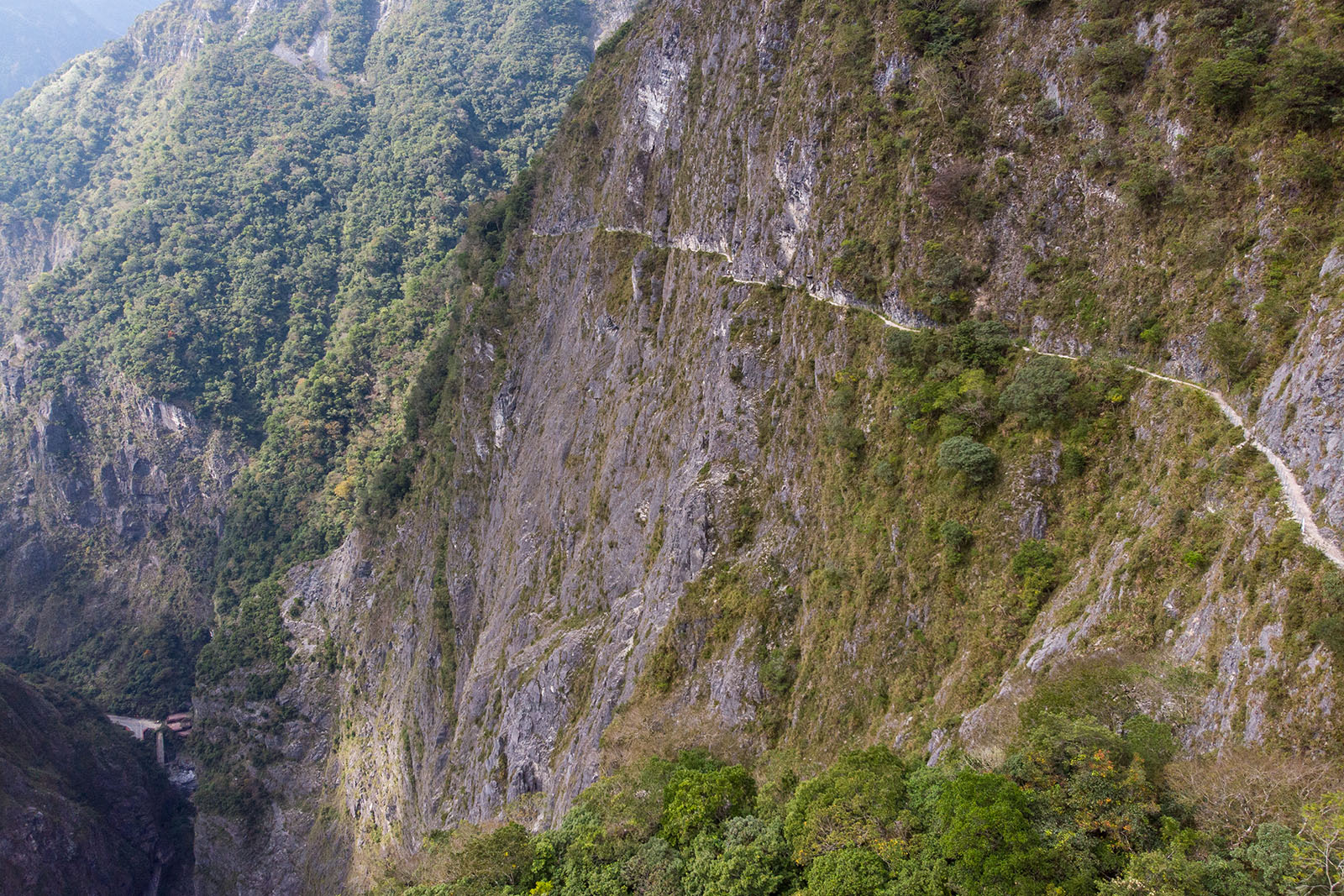 A view of the most dangerous part of the Zhuilu Old Trail, this 1 meter path is carved into a sheer 500 meter cliff.