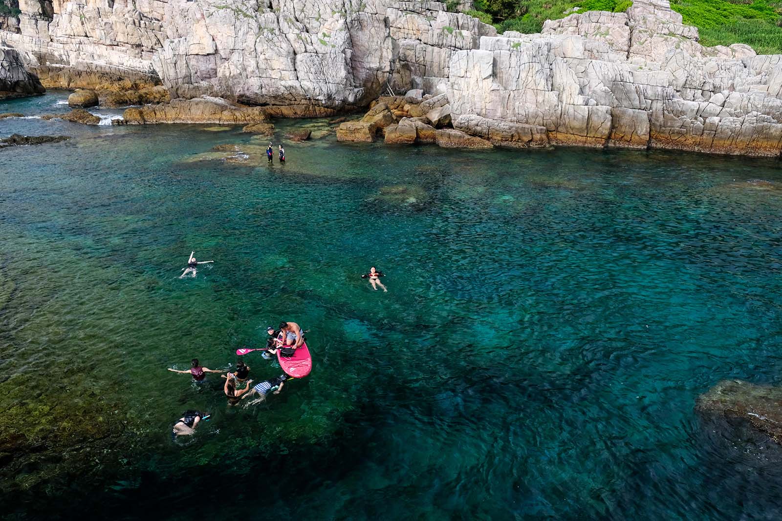 Snorklers, standup paddleboarders and divers all share the waters in Longdong Bay.