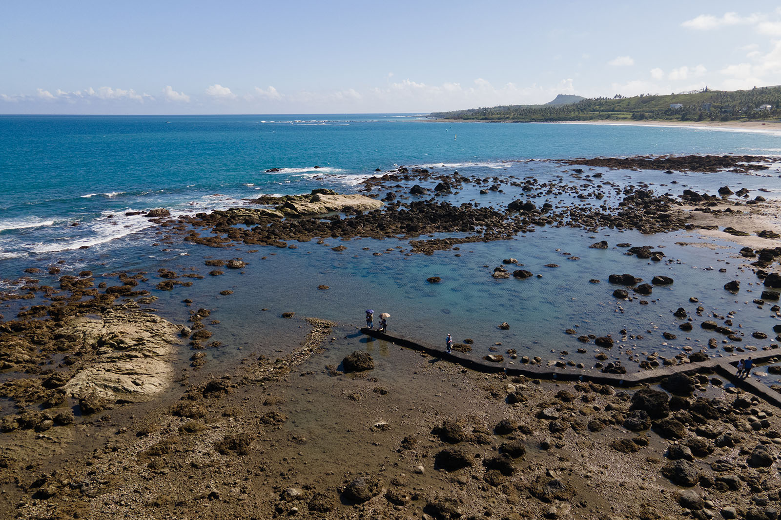 The Fushan Fish Recovery Area features walkways that extend into the tidal zone allowing for easy observation of the local marine life.