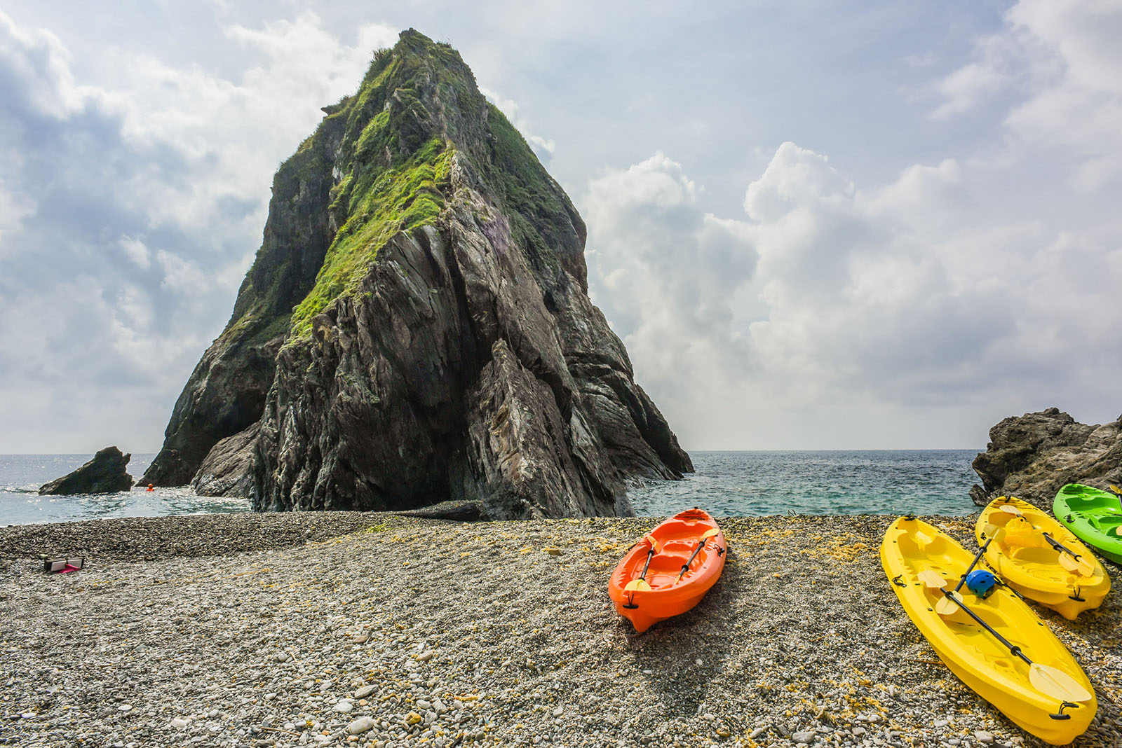 Kayaks resting in a hidden cove just beside Dongao Bay.