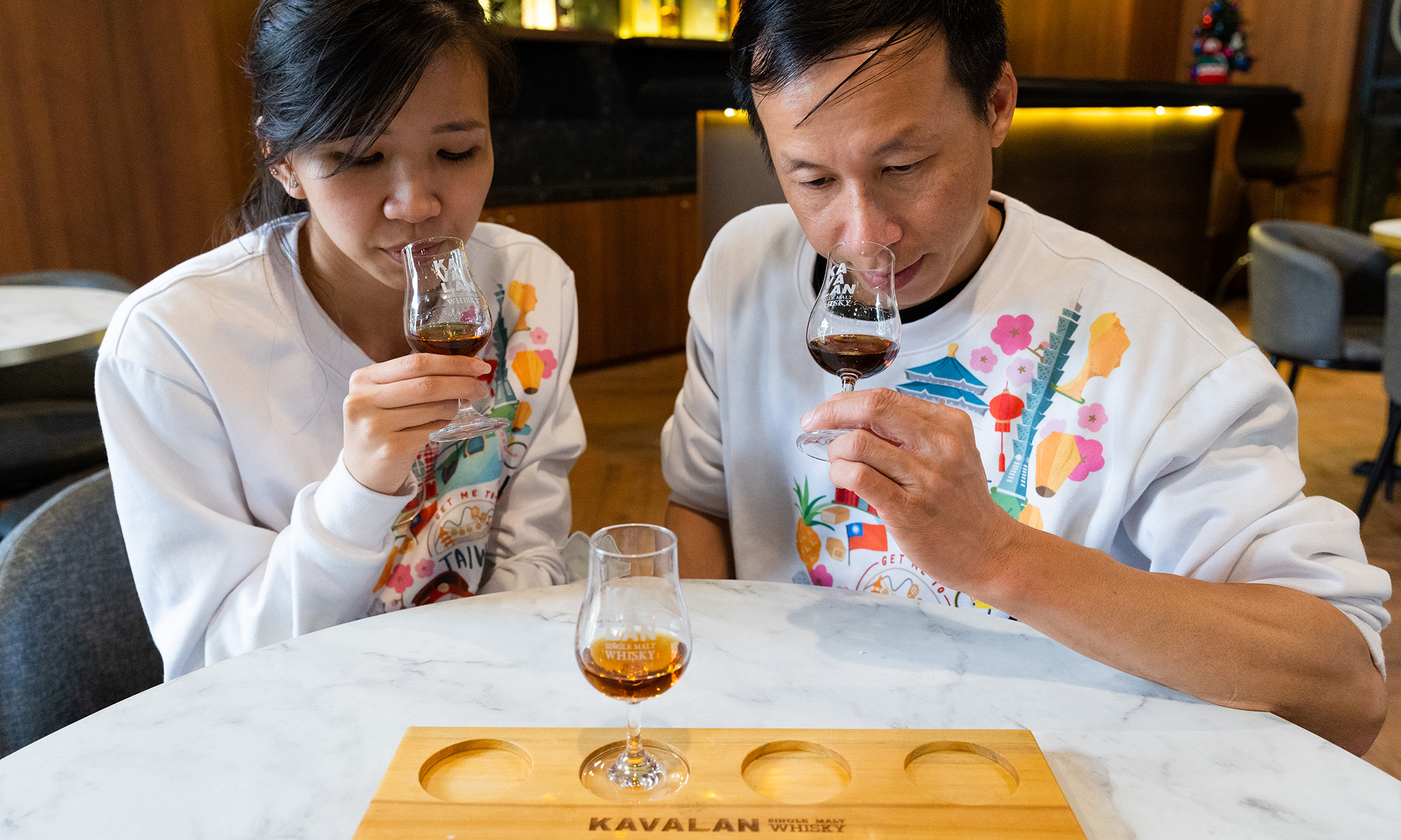 A couple tastes Whiskey at Yilan's Kavalan Distillery.