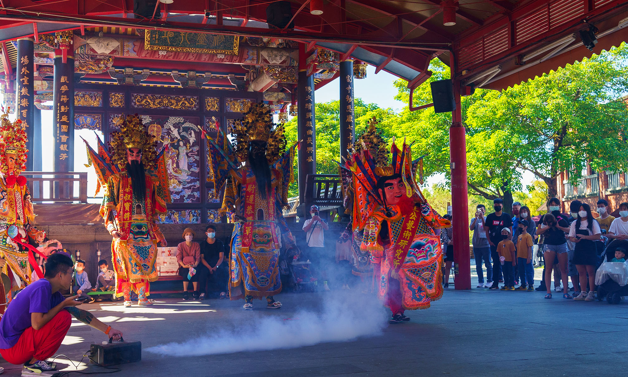 Spectators watch a "temple fair" performance at the National Center for Traditional Arts in Yilan.