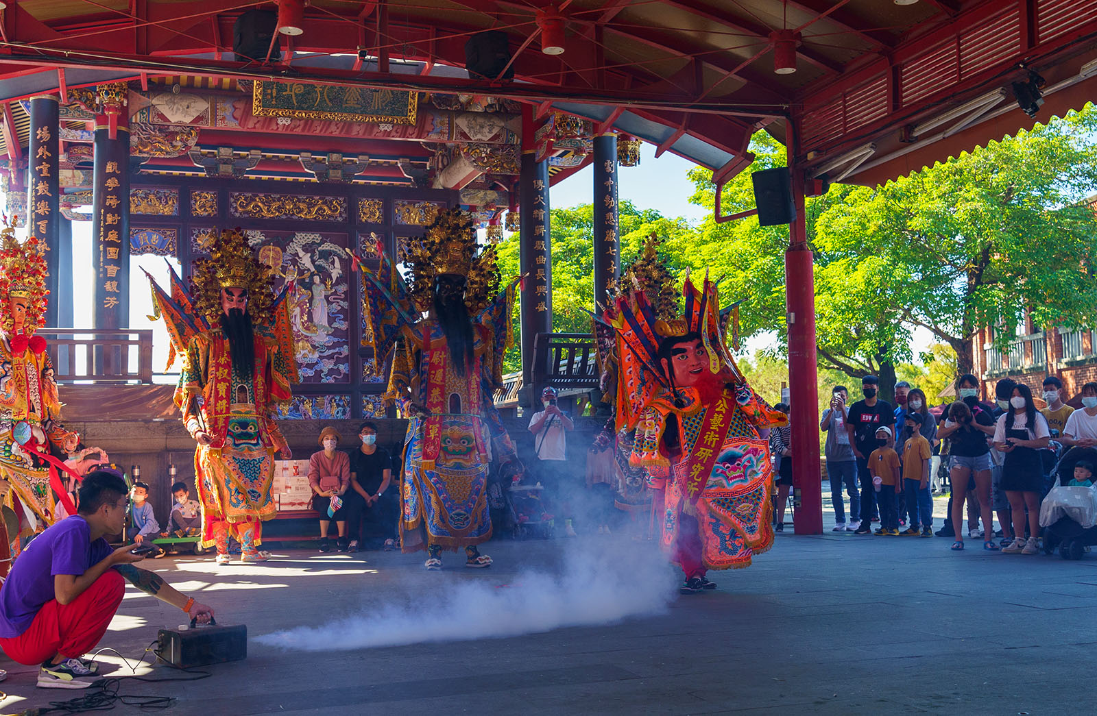 Spectators watch a "temple fair" performance at the National Center for Traditional Arts in Yilan.