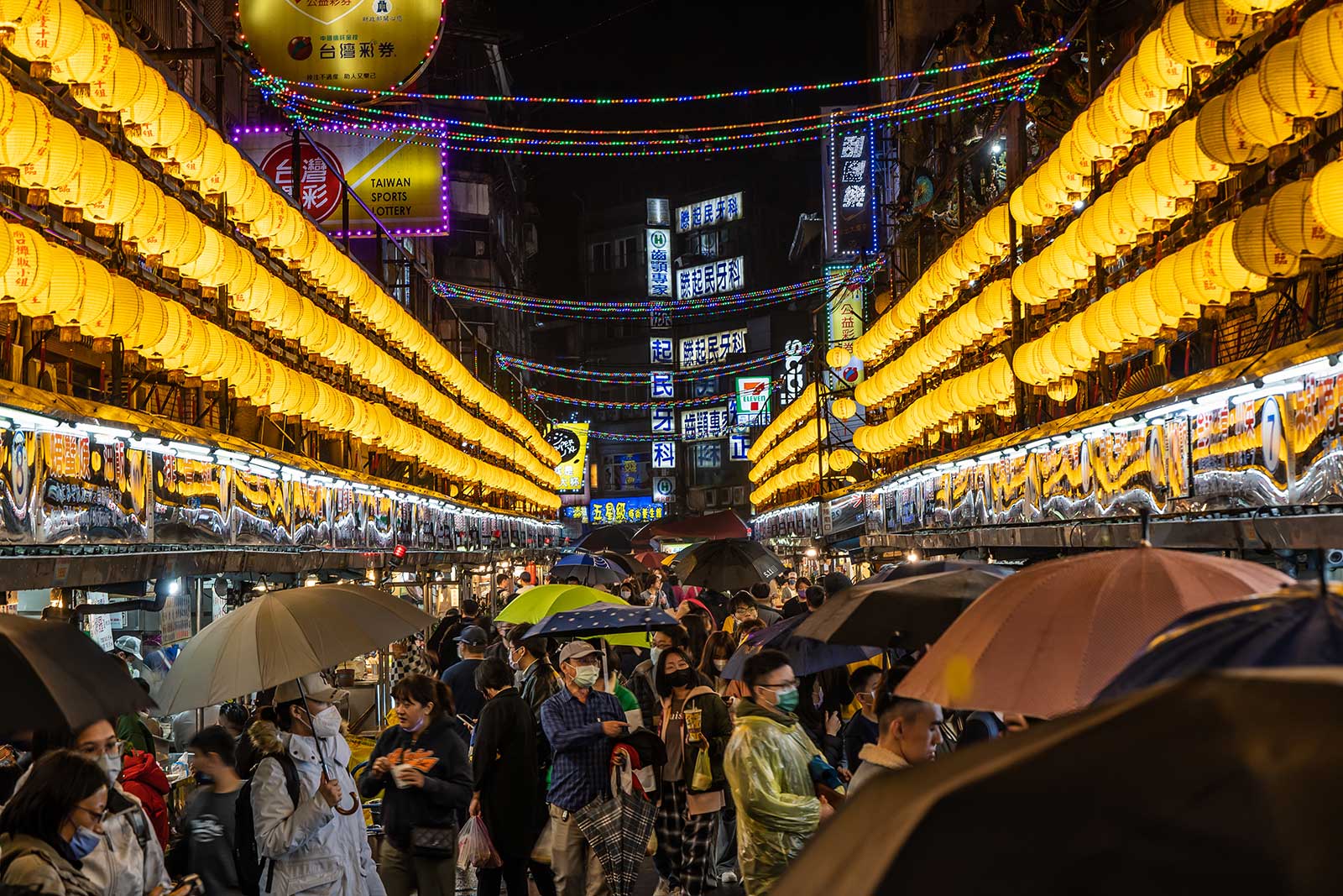 Three rows of lanterns line either side of Keelung Night Market.