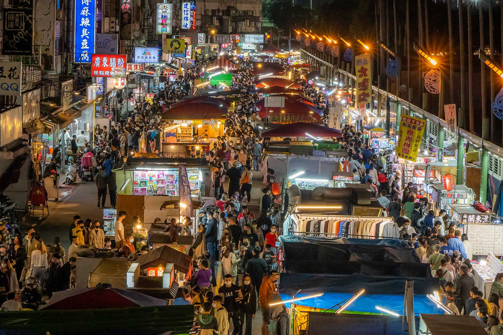 Three rows of night market stands seen from above.