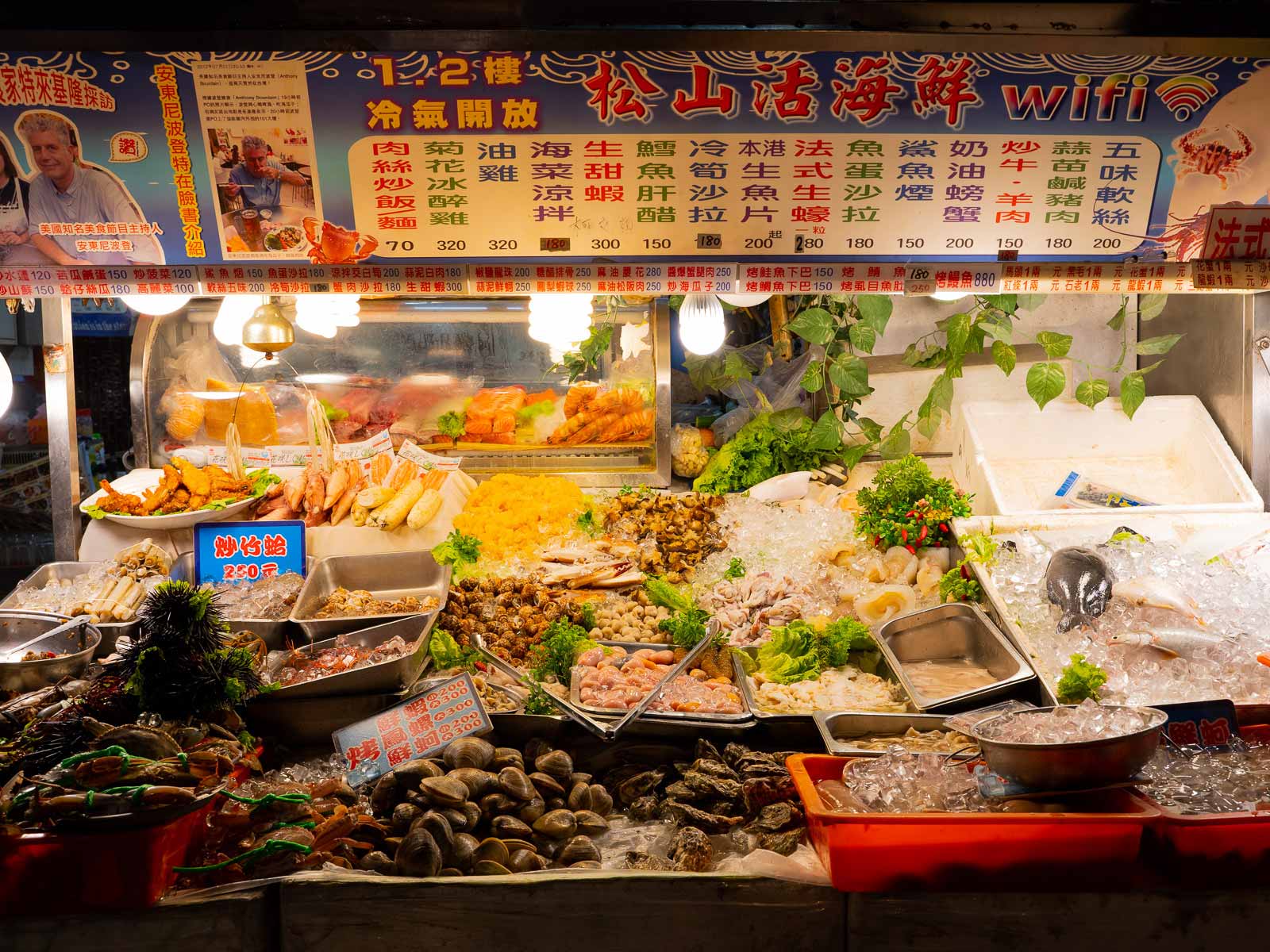 Assorted fresh seafood on display outside of an eatery.