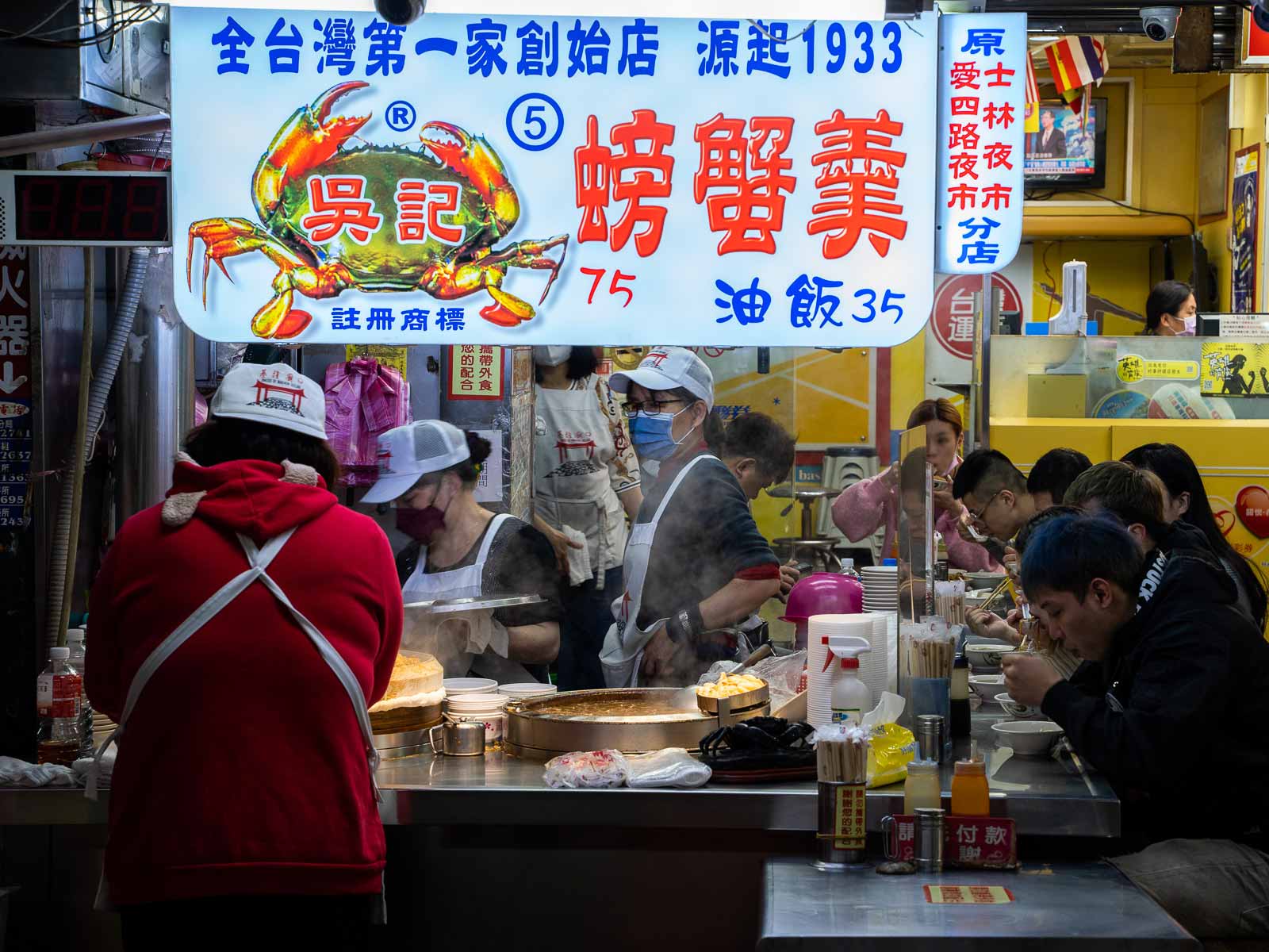 A stall, which has been operating since 1933, sells crab soup on the side of the street.