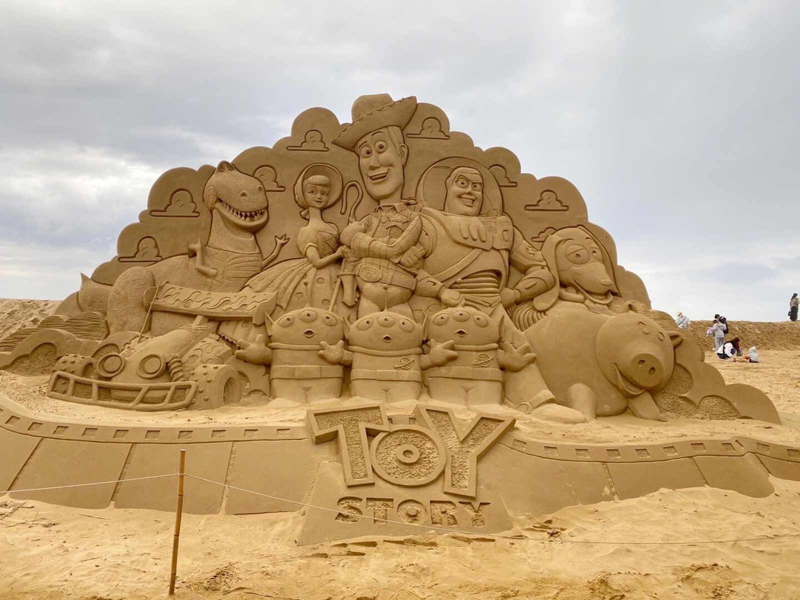 A three-meter-tall Toy-Story-themed sand sculpture.