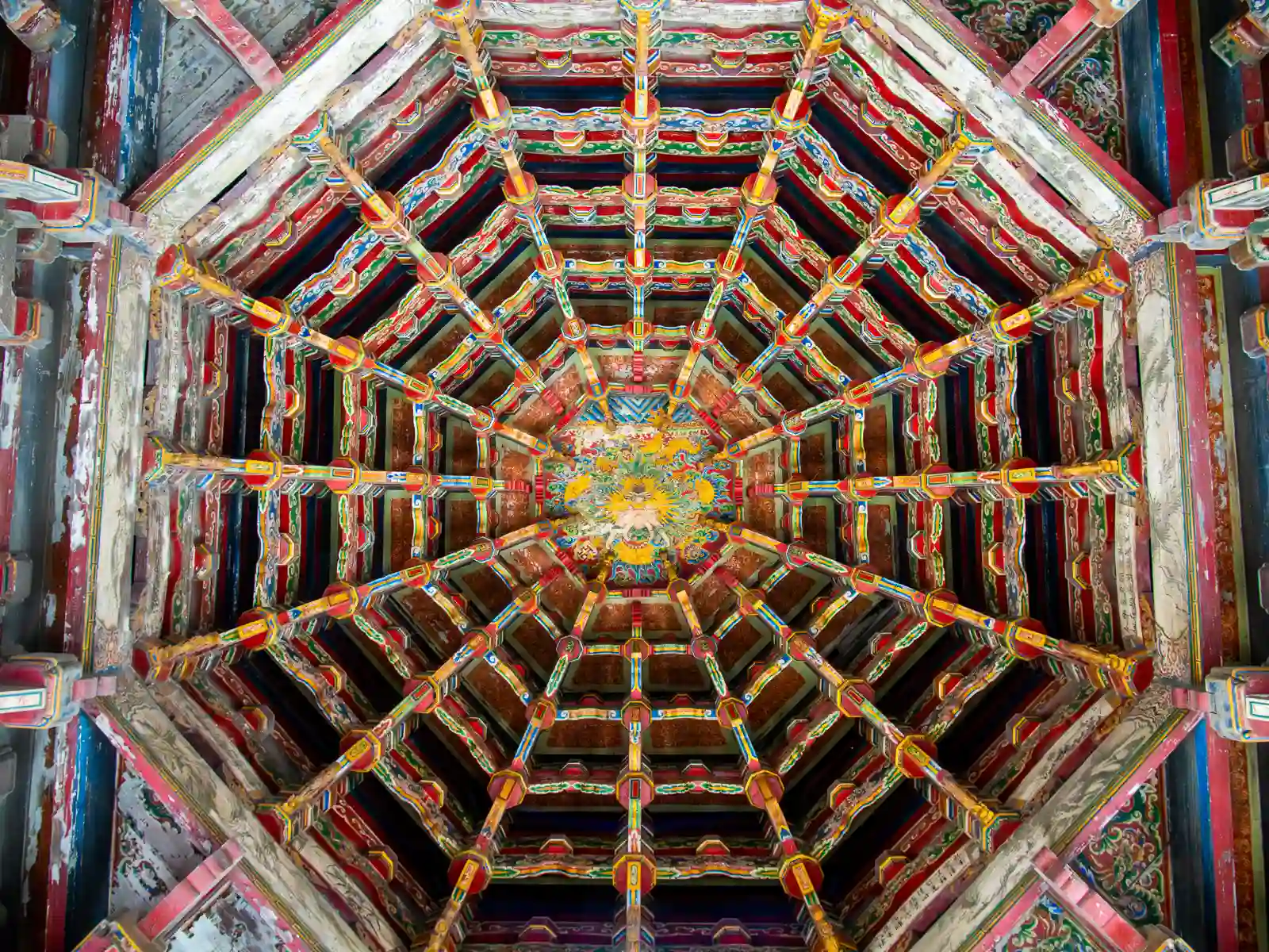 Looking directly upwards into the colorful caisson ceiling in Lukang Longshan Temple