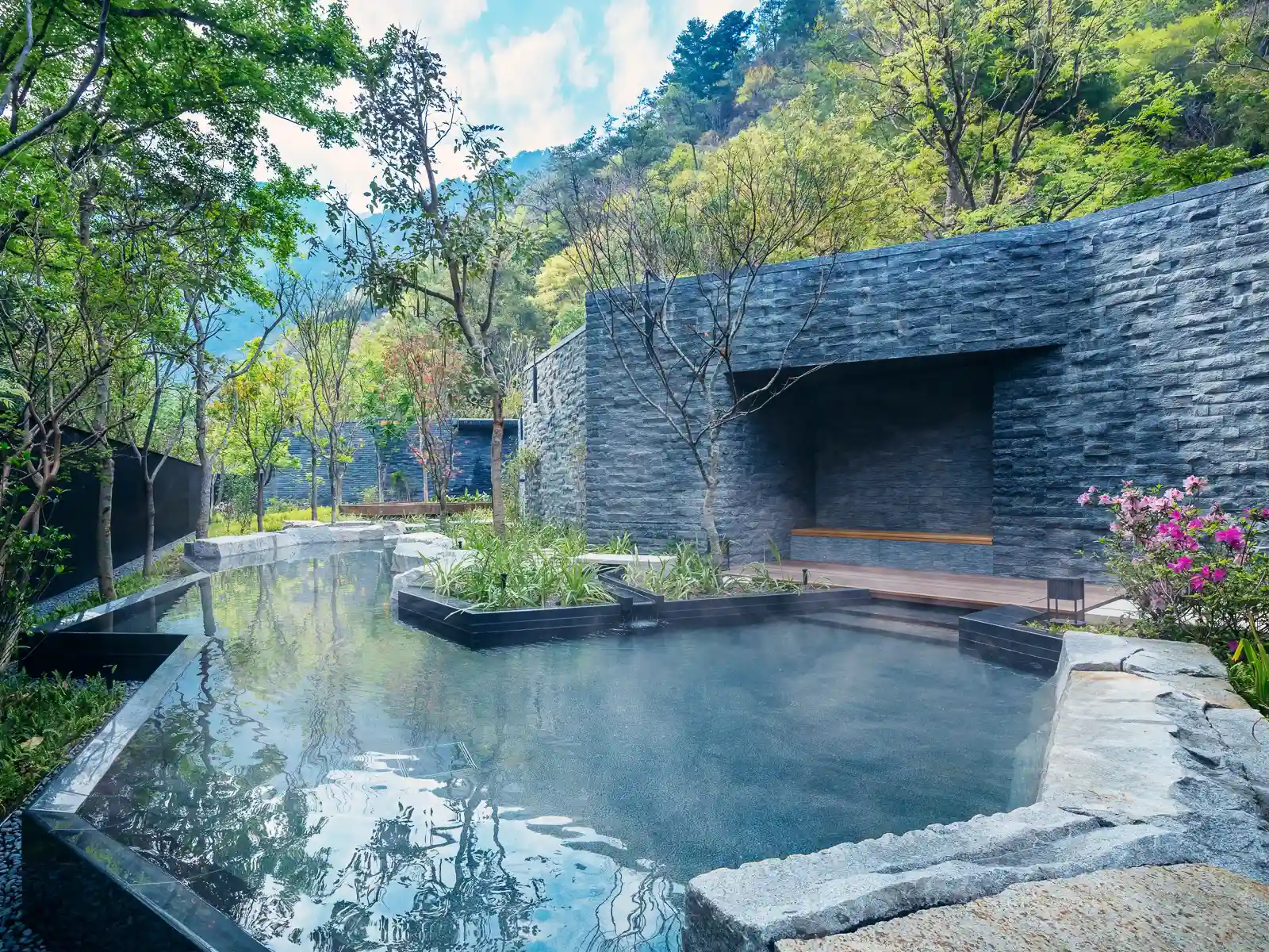 Water steams in another outdoor hot spring pool.
