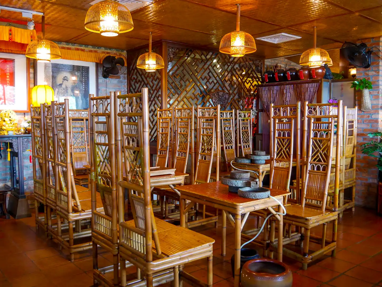 The interior of Amei Tea House is filled with carved wooden furniture