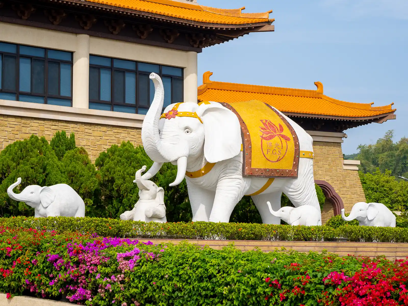 A statue of an erudite-looking elephant surrounded by their calves stands to the right of the entrance to the Front Hall.