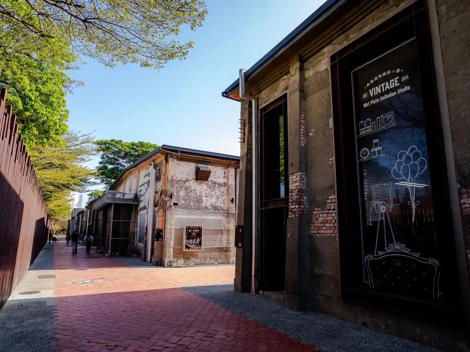 An alley leads between warehouses which contain shops and exhibition halls.