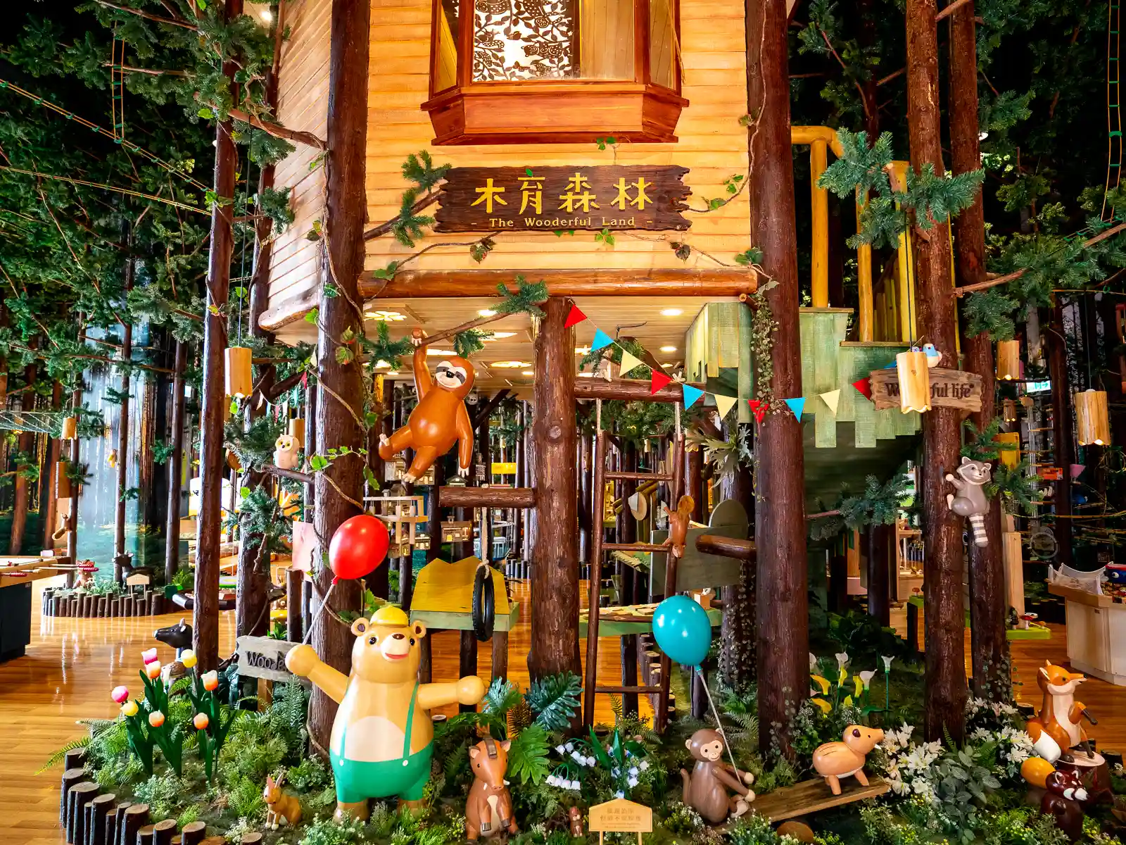 A sign above several wooden toy statues reads "The Wooderful Land".