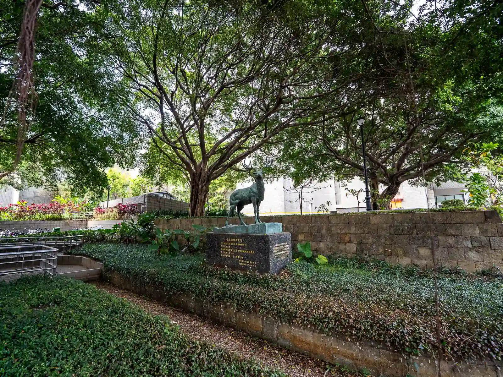 A sculpture of an elk is on display in the museum's botanical garden.