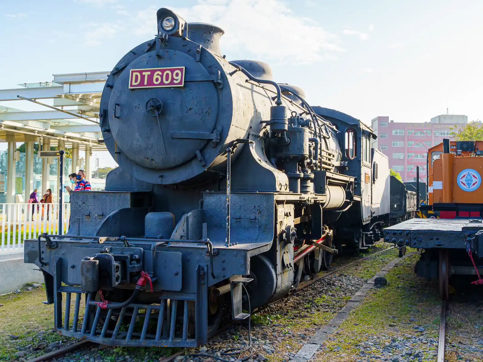 A front shot of a beautiful steam locomotive on display.