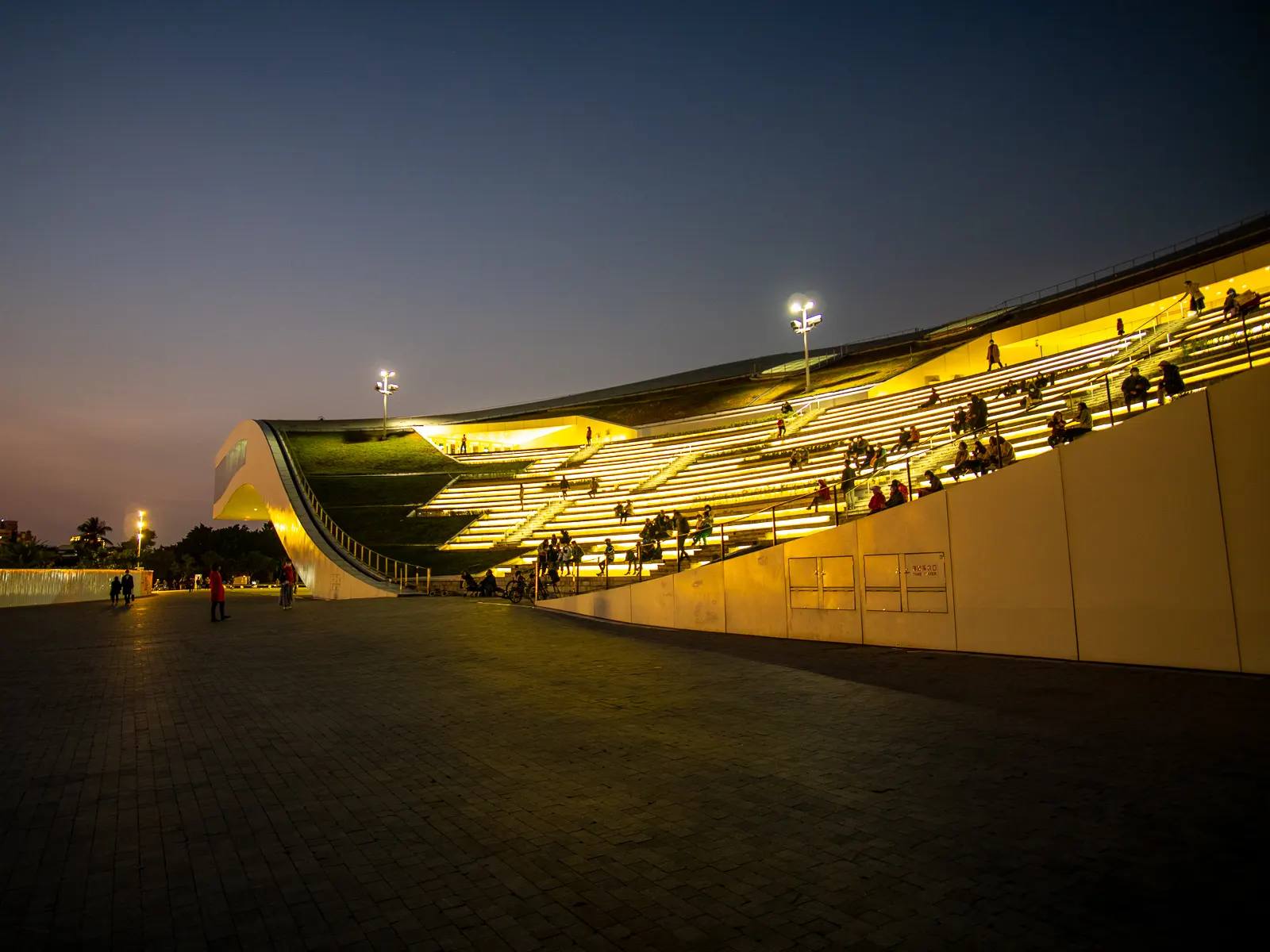 Wuweiying's outdoor pavilion viewed at night.