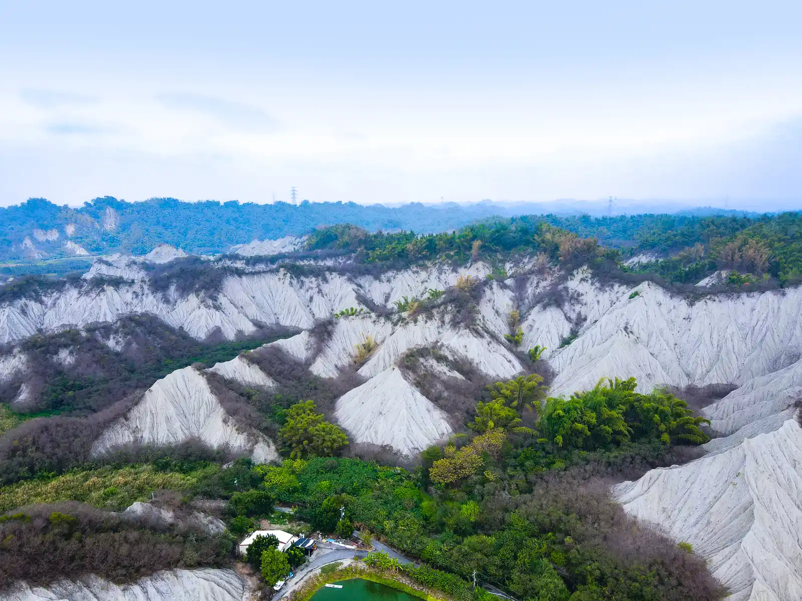 An aerial view of the eroded ridgelines of Tianliao Moon World.