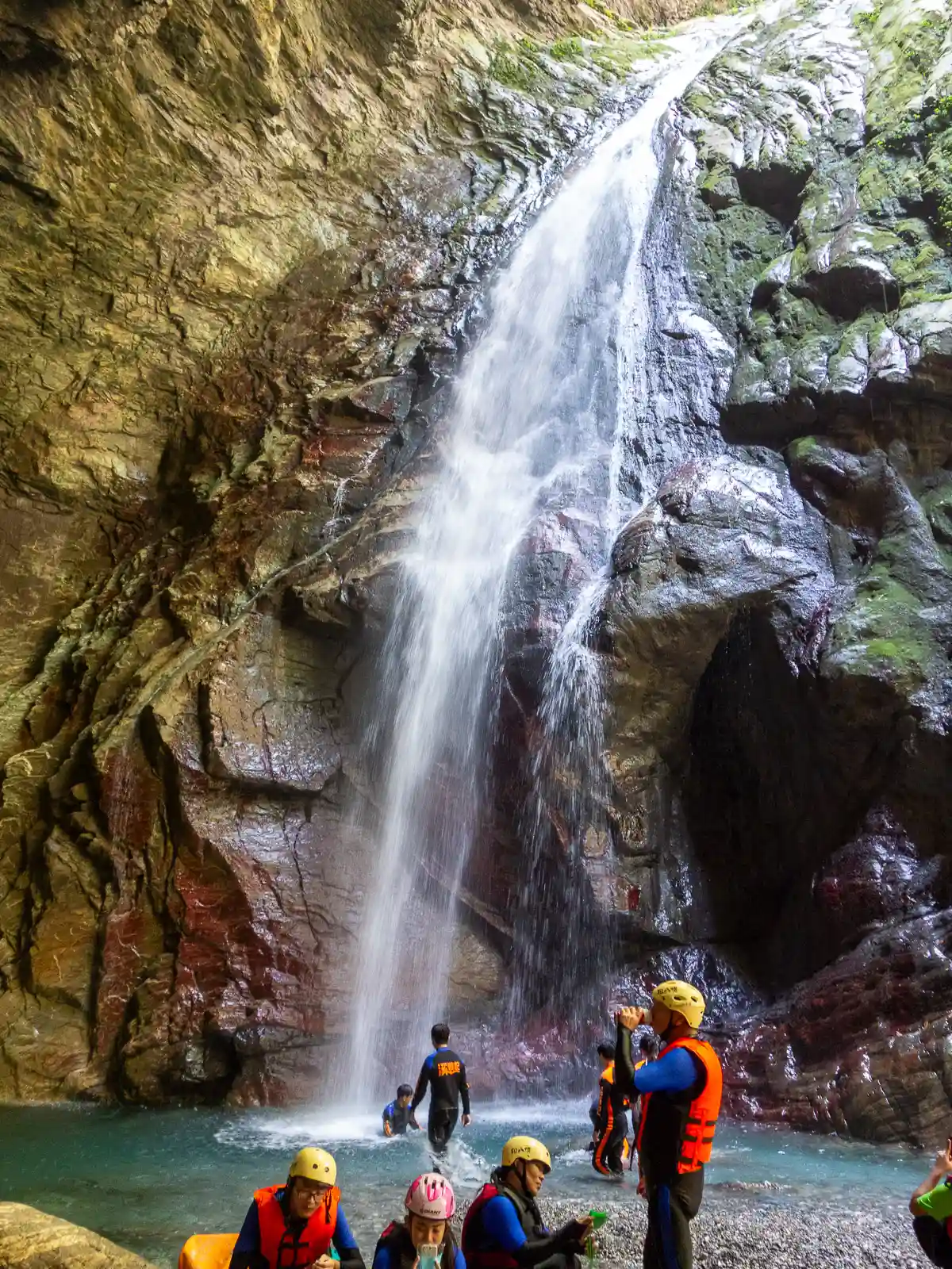 A 40-meter-tall waterfall pours into a cavernous cave-like space.