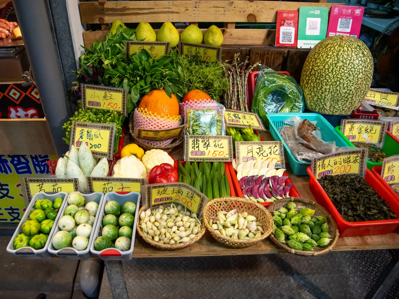 A selection of foraged wild vegetables is on display outside of an eatery in Dongdamen Night Market.