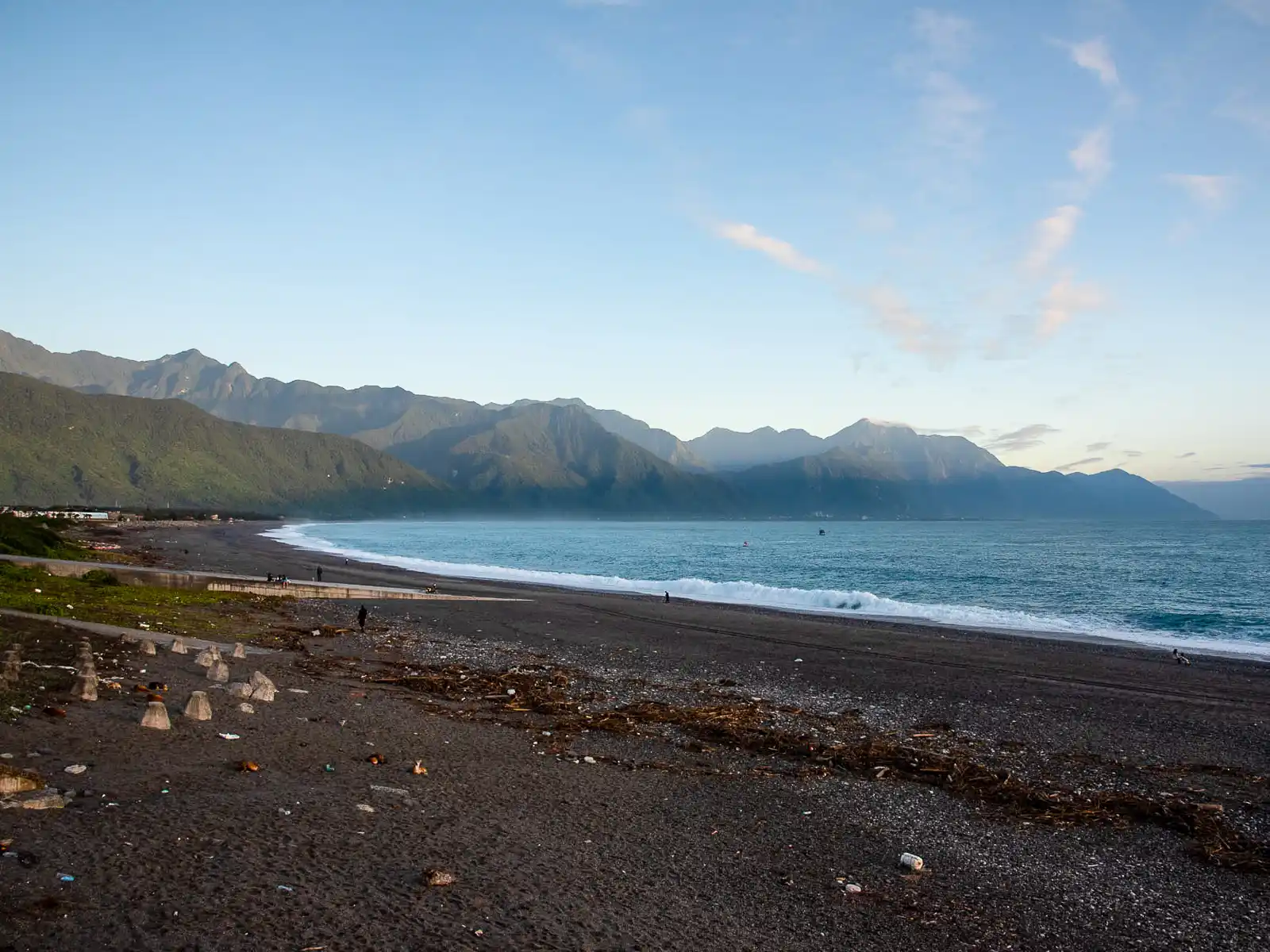 The beach extends into the horizon where the mountains of Taroko National Park rise up.