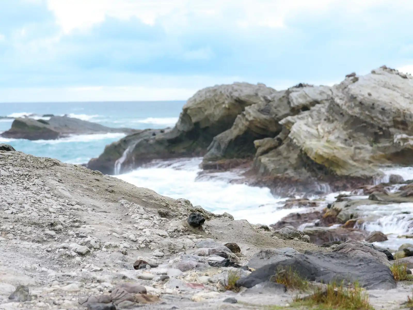 A rocky surface appears to be slowly eroding.