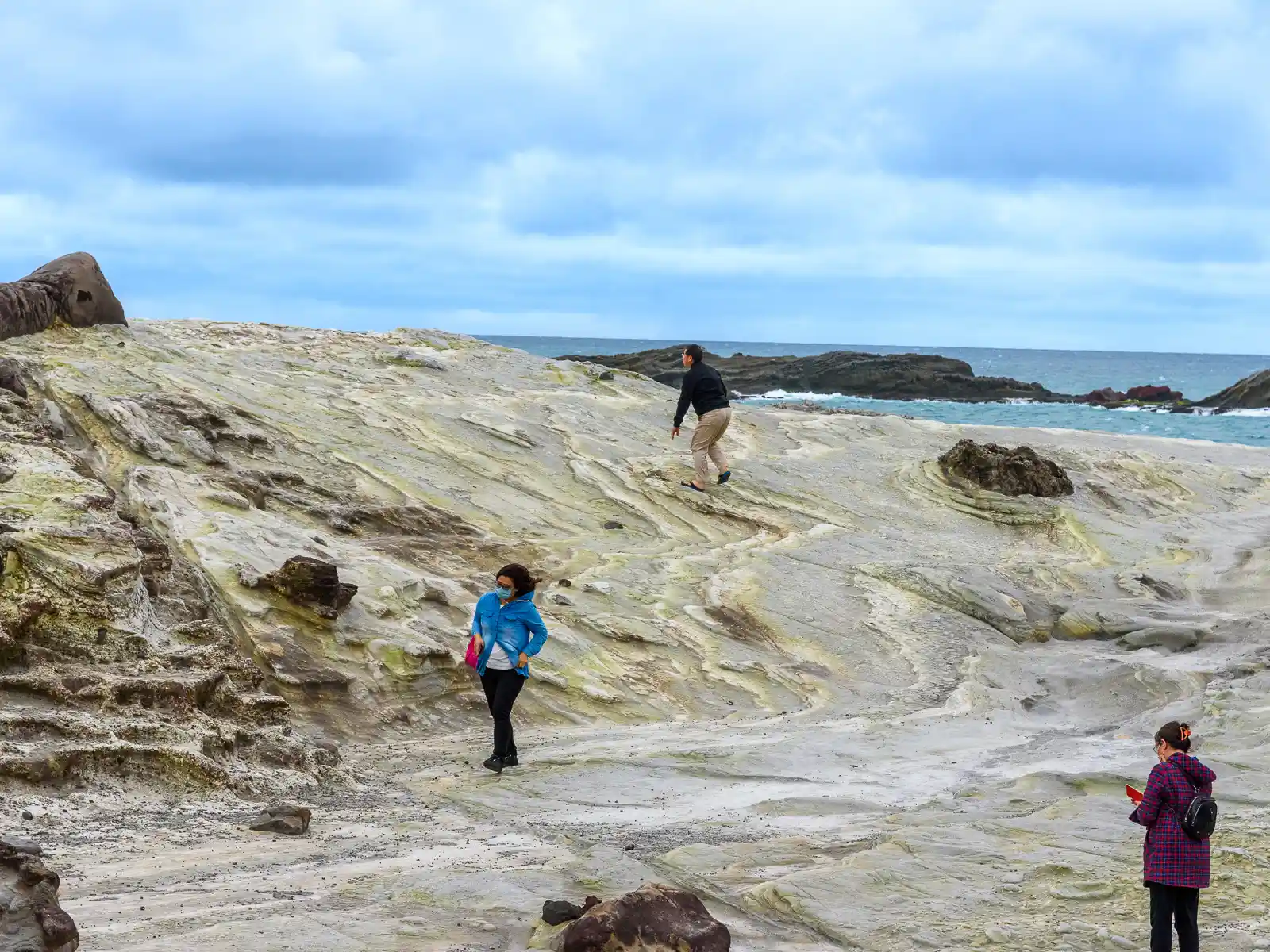 A rock feature has been eroded down layer-by-layer, creating what looks like 2-dimensional waves.