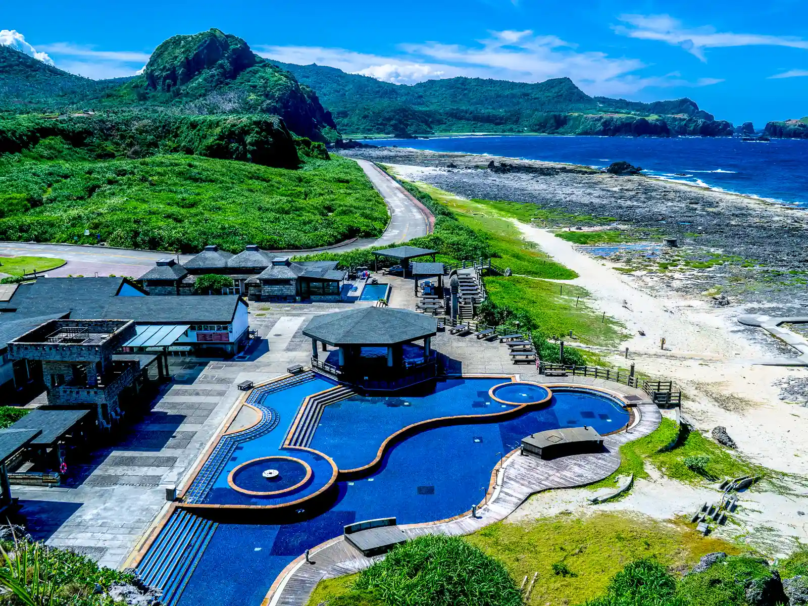 The Zhaori Hot Spring complex features a multitiered pool just steps away from the beach and shoreline.