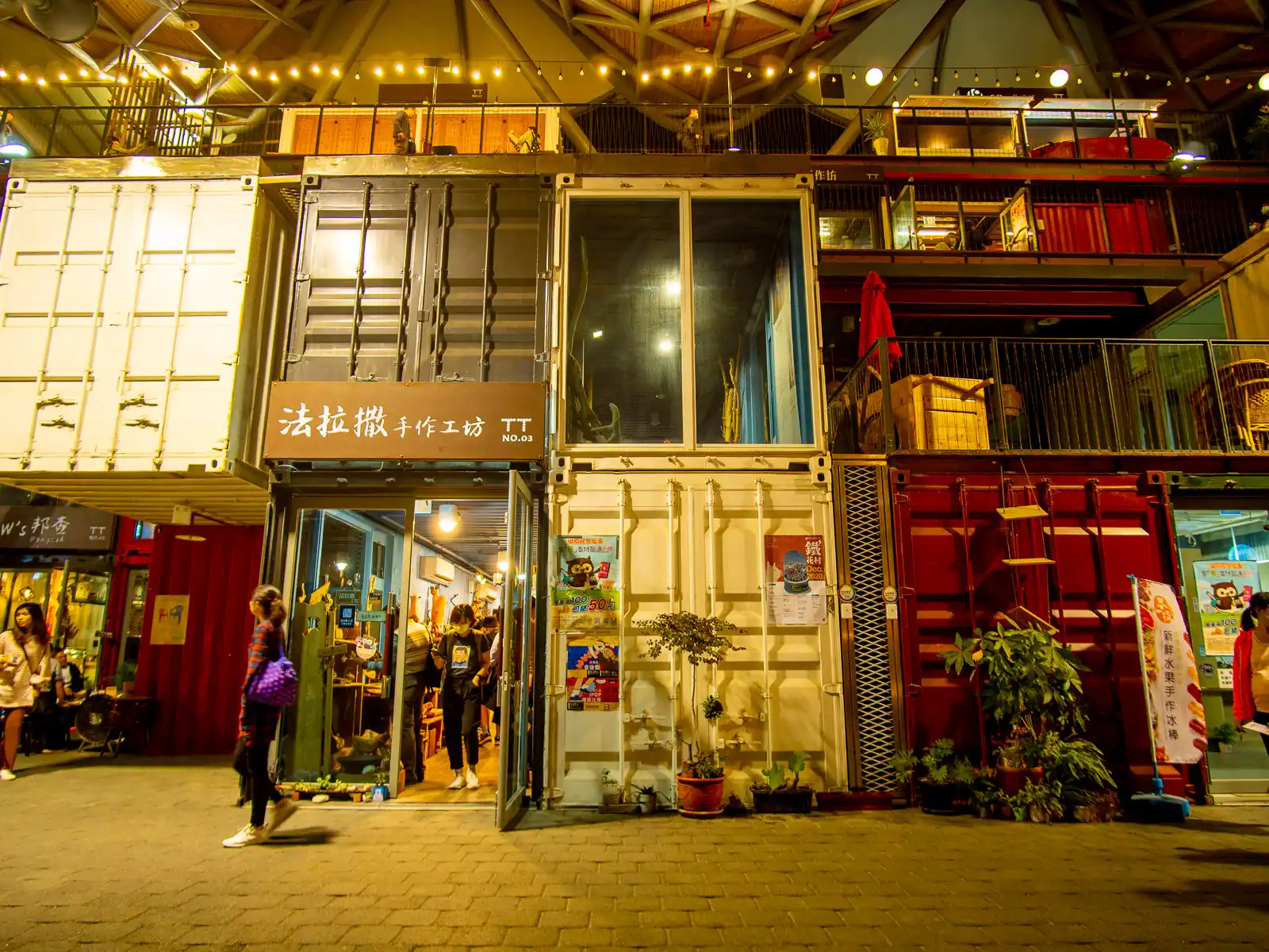 A complex of cargo containers is home to shops.