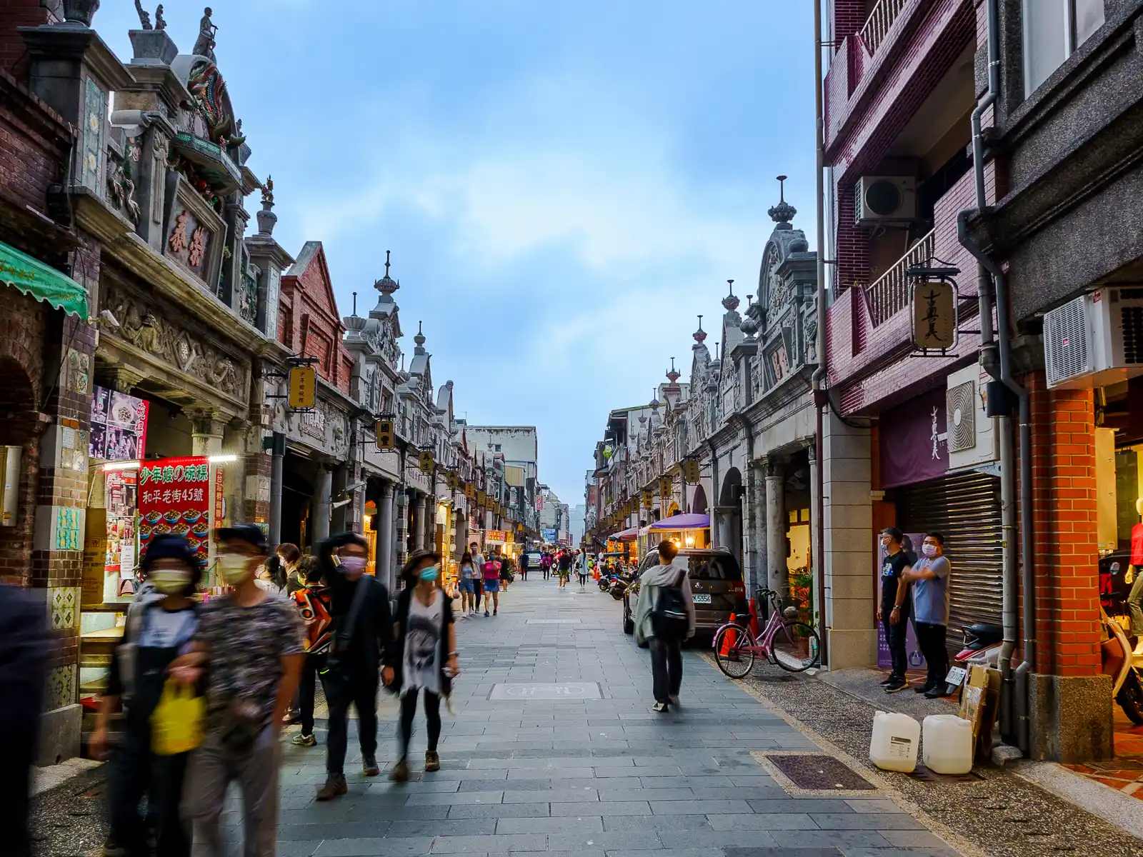 Elaborate storefronts decorated with stone columns and extravagant roof carvings extend down Heping Street as far as the eye can see.