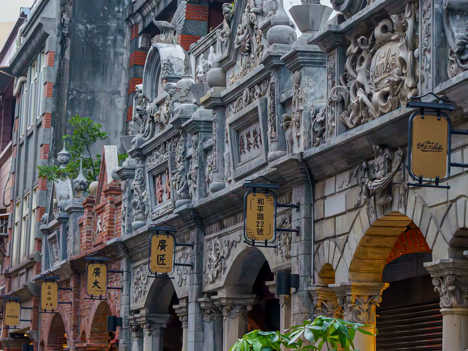The facades of storefronts on Daxi Old Street are decorated with intricate stone reliefs.