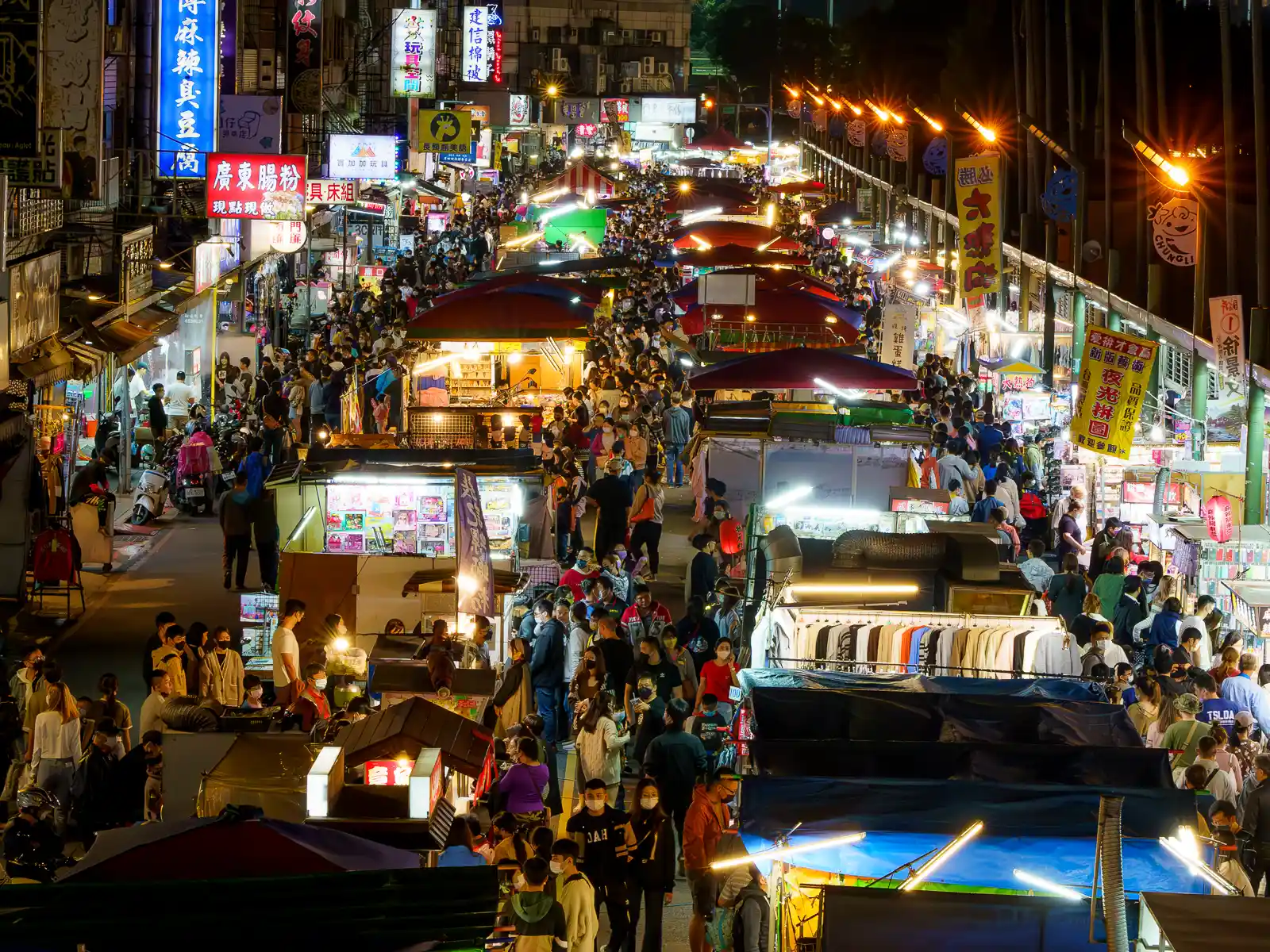 An aerial shot of the three aisles of Zhongli Night Market at night.