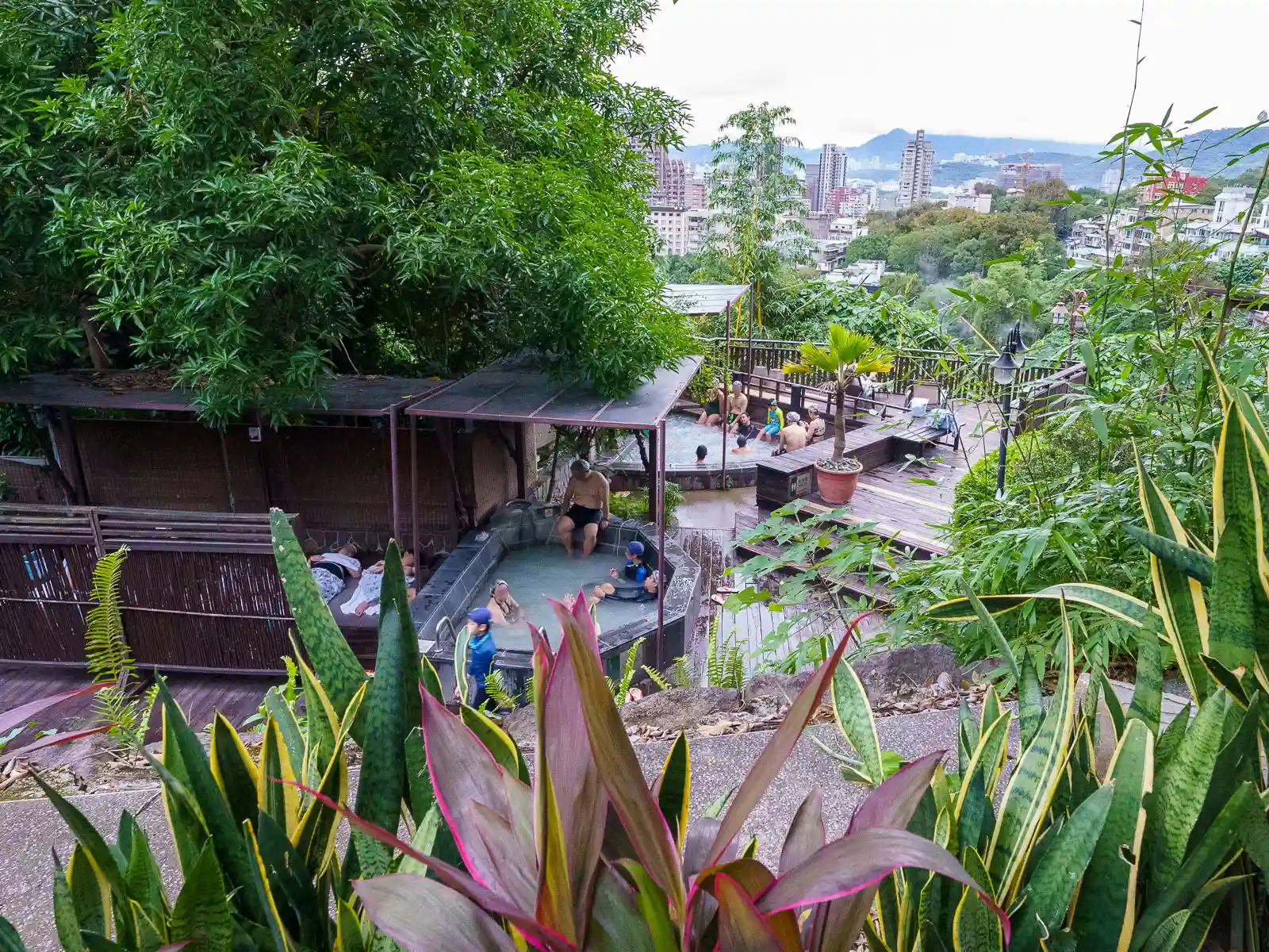 Bathers relax in the open-air public hot spring in Beitou.