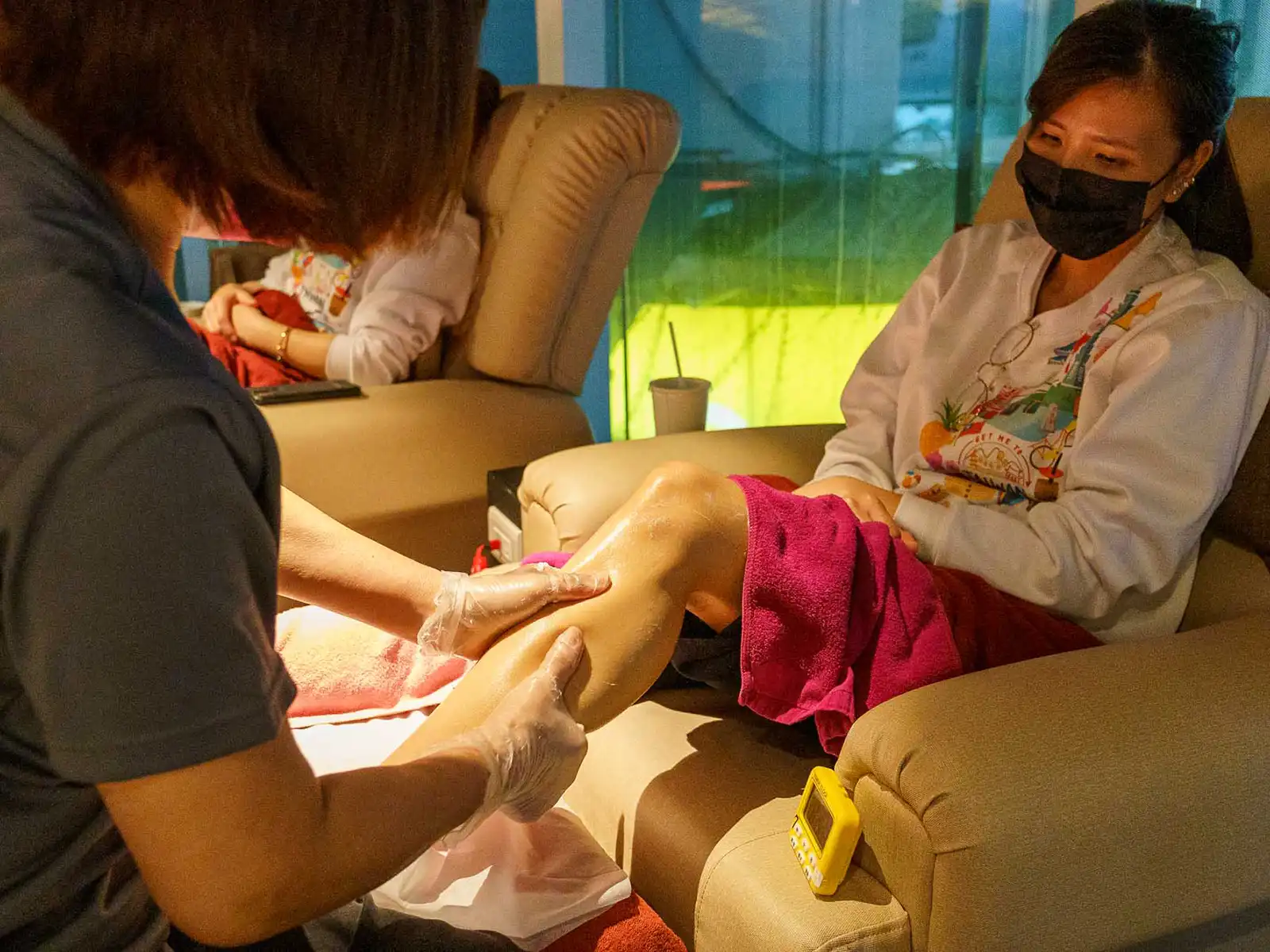 A person gets a leg massage at a spa.