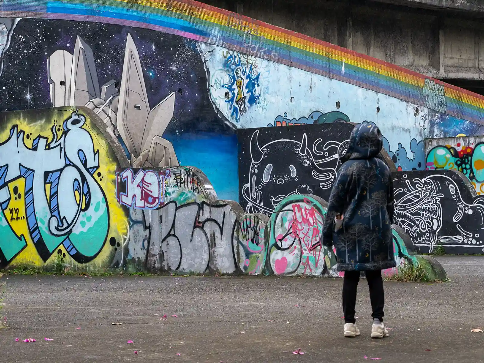 Various graffiti covers the walls surrounding the village.