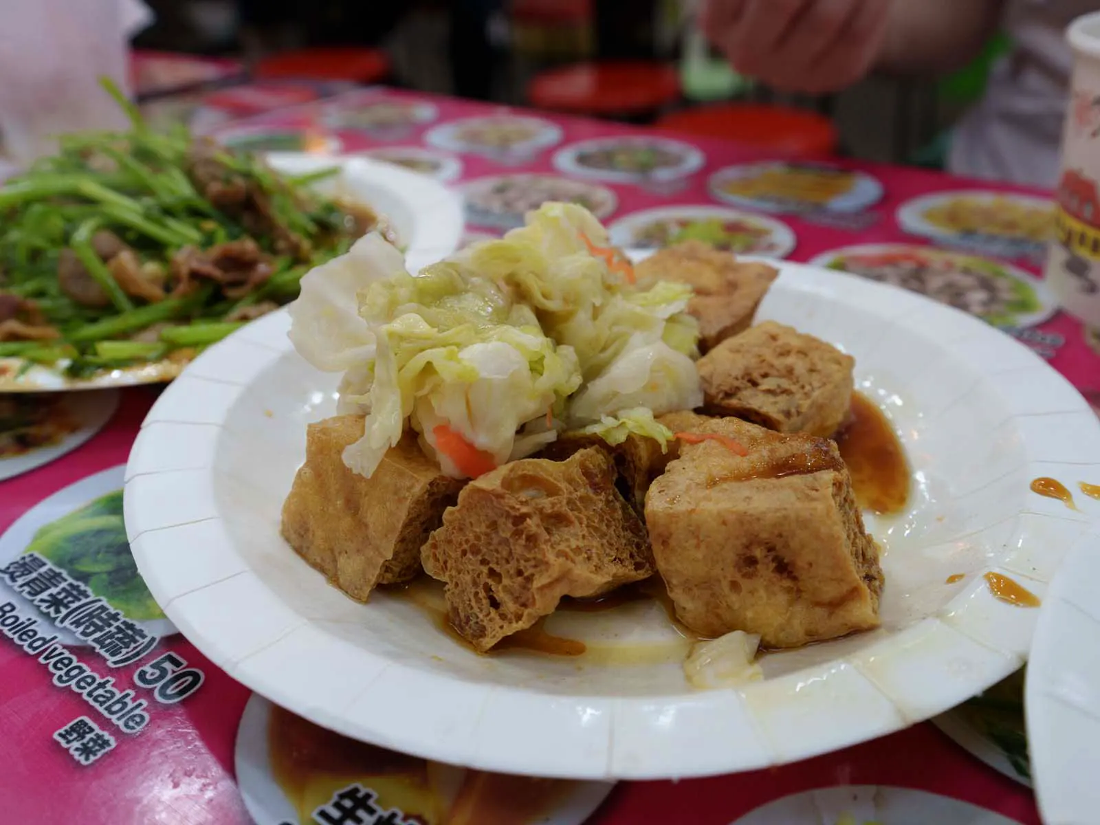 A plate of stinky tofu with pickled cabbage, a Taiwanese delicacy.